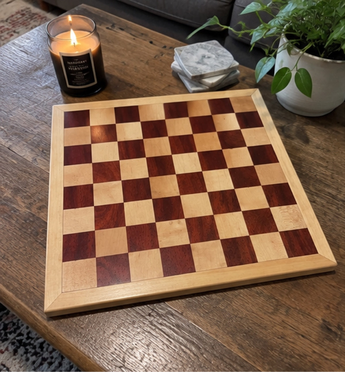 Handmade wooden chessboard on a coffee table